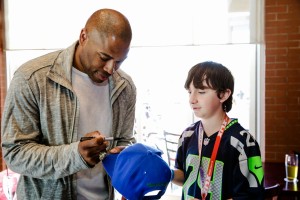 Seahawk's great Shaun Alexander signing autographs for fans  